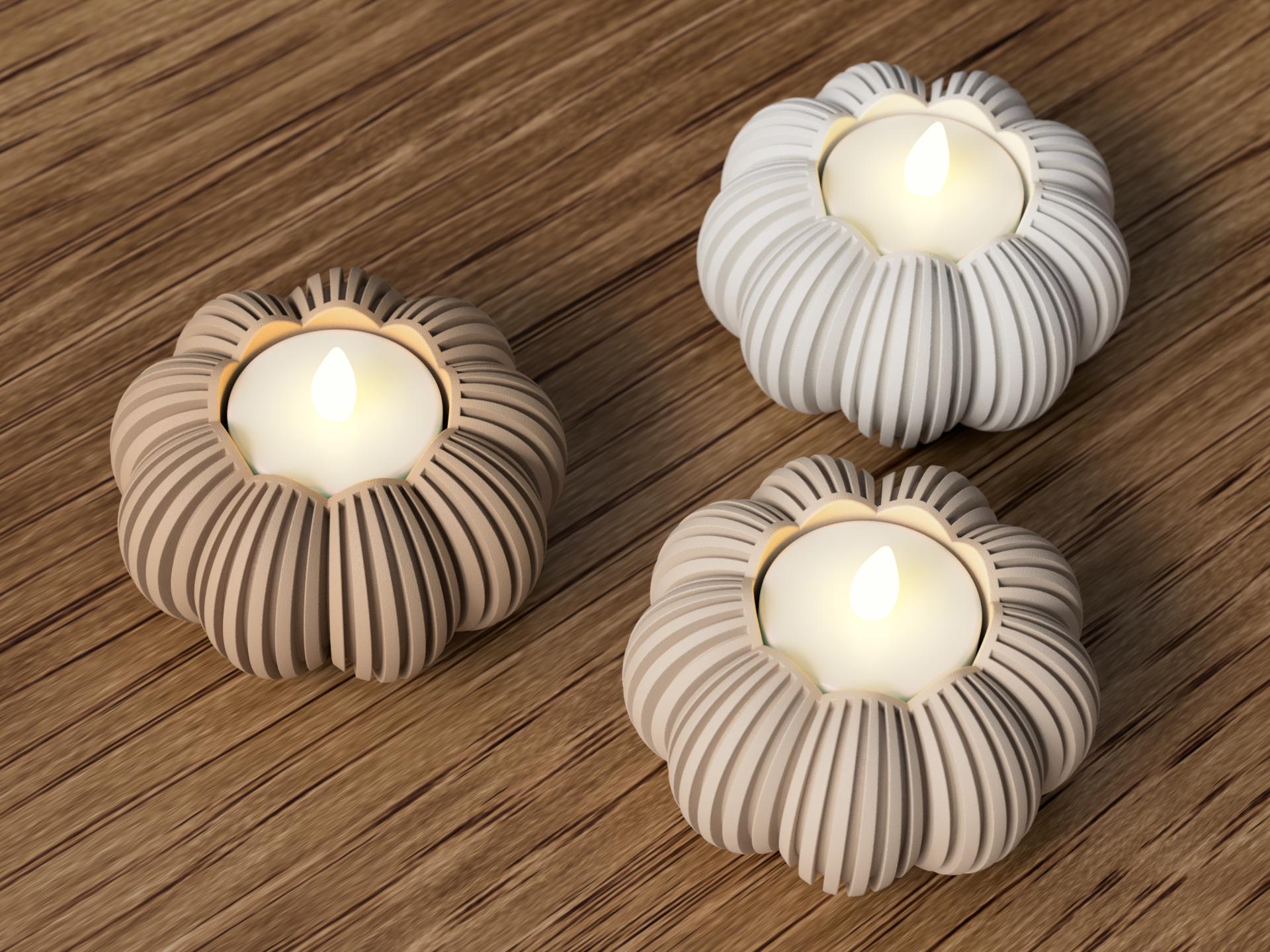 Trois bougeoirs décoratifs en forme de fleur, de différentes nuances de gris et de beige. Chaque bougeoir présente des rainures verticales et contient une bougie LED blanche avec une flamme vacillante, créant une ambiance chaleureuse. par Flexura3D.